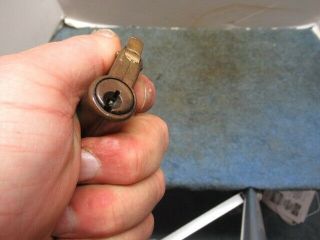 Very unusual old brass CORBIN padlock lock w/key.  Keyhole on side of body.  n/r 3