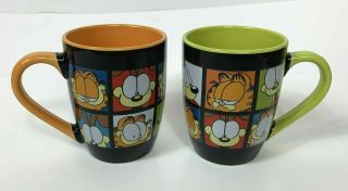 Set Of 2 Paws Garfield Coffee Mugs By Jim Davis Black Orange Green Faces Odie