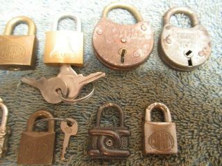 10 different old miniature padlock lock.  2 are combination.  3 with a key.  n/r 3