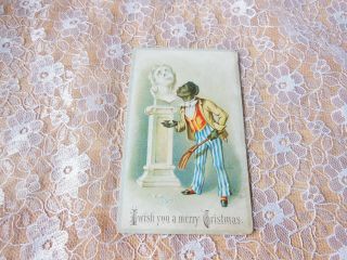 Victorian Christmas Card/black Figure Dusting Statue And Breaking Its Nose