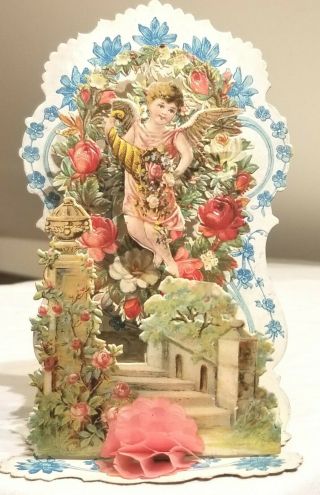Cupid Hovering Over Victorian Flower Garden.  3 - Dimensional Card.  Early 1900s.