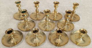 11 Baldwin Brass Candle Holders 2.  5 & 4 Inches Tall All With A 3.  25 Inch Base