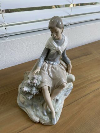 Nao By Lladro Figurine Girl Resting On A Log With A Hat