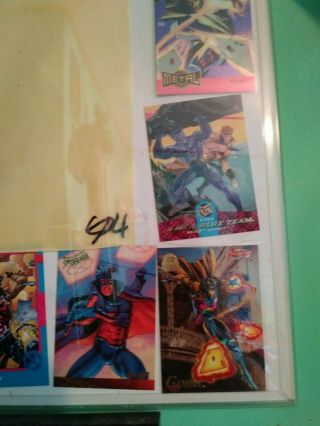 gambit 1990 ' s cartoon photo cell with cards and one card signed steven butler II 2