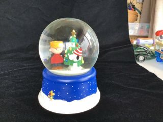 Peanuts 50th Anniversary Musical Winter Snow Globe.  Plays “snoopy Theme”.