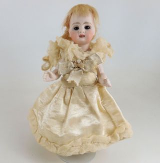 Charming Antique Six Inch Fully Jointed All Bisque Doll With Clothing
