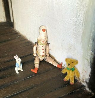Antique German All Bisque Hertwig Jester Doll.  Cast Iron Rabbit.  Teddy Bear.