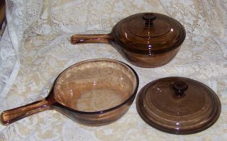 Two Corning Vision Ware.  5 L Amber Glass Pots Sauce Pans W/ Lids Euc