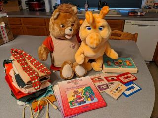 Teddy Ruxpin & Grubby W/cord,  7 - Pc Outfits,  6 Tapes/2 Books,  Answer Box