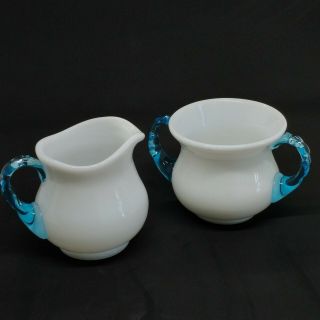 White Milk Glass Sugar And Creamer Set With Clear Blue Glass Handles