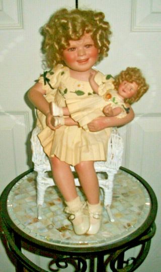 Shirley Temple & Her Doll By Danbury In A White Wicker Rocking Chair