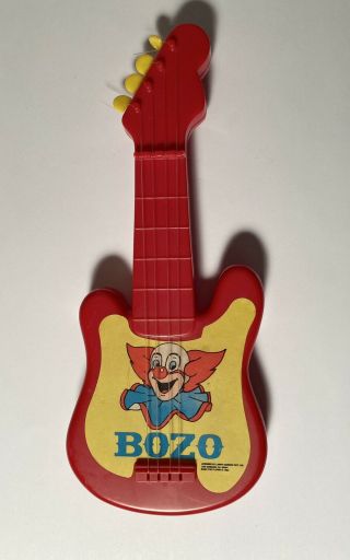 Vintage Bozo The Clown 7.  5 " Long Plastic Toy Guitar