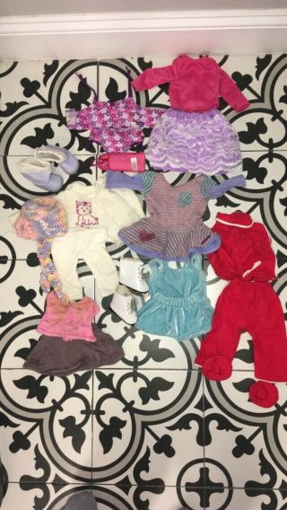 pre - owned American girl doll (lily).  blonde.  comes with clothes and accessories. 2