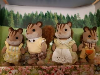 In boxes Sylvanian families Tree house 4618 and Walnut Squirrel family 4172 3