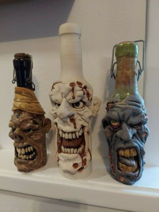 Dan Norton Raku Face Jug.  Zombies And Mummy Bottles