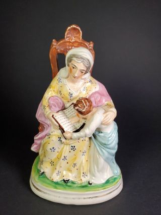 Staffordshire Pottery Figurine Of Mother And Child Reading Book