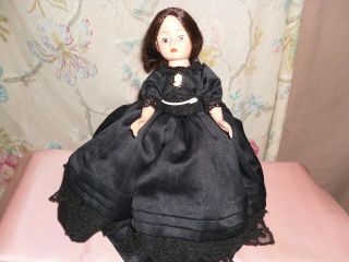 Madame Alexander Cissette Wearing Black Dress With Cameo