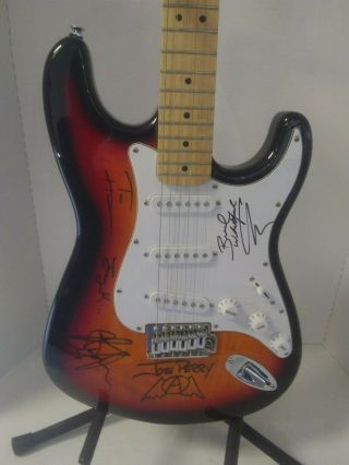 SUNBURST FENDER ELECTRIC GUITAR AUTOGRAPHED BY AEROSMITH WITH & APPRAISAL 2