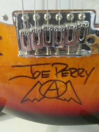 SUNBURST FENDER ELECTRIC GUITAR AUTOGRAPHED BY AEROSMITH WITH & APPRAISAL 3