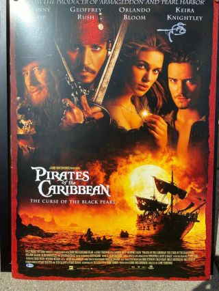 Johnny Depp Autographed Pirates Of The Caribbean Movie Poster With Beckett