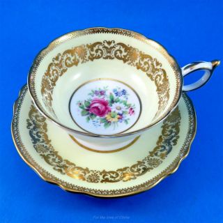 Pretty Yellow & Gold Border With Floral Center Paragon Tea Cup And Saucer Set