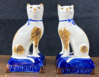 Matched Pair 2 Antique Staffordshire Cat Figurines Blue Pillow & Bow Brown Spots