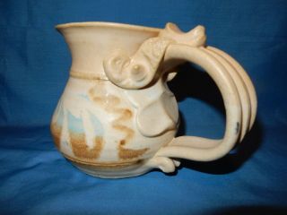 John Schulps Studio Pottery Face Mug Coffee Cup Handthrown Signed Stoneware Tan