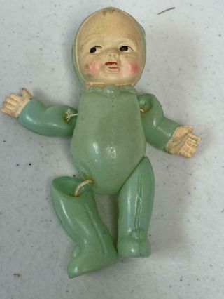 Vintage Occupied Japan Celluloid Miniature Baby Doll In Green Suit