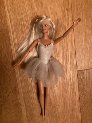 Barbie doll with Jointed arms,  sports clothing and accessories,  exc 3