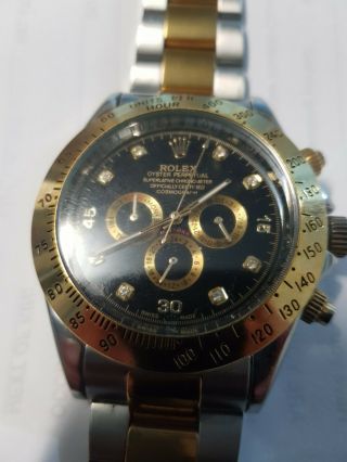 ROLEX DAYTONA GOLD WATCH WITH STONES IN HOUR PORTS.  SOME LINKS MISSING. 6