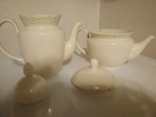 1 Go Dinger.  Cream lace Lg.  9in.  Fine Porcelain Teapot,  an 1 coffee pot. 3