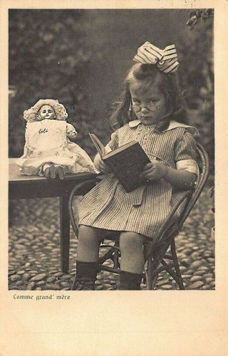 Young Girl Reading To Her Doll " Comme Grand 