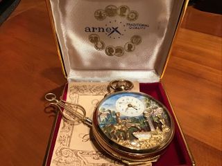 Arnex Music Mechanical Moving Face Musical Pocket Watch Gold Plated.  With Key