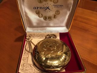 Arnex Music Mechanical Moving Face Musical Pocket Watch Gold Plated.  With key 2