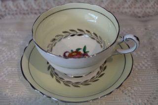 Paragon Pale Yellow Double Warrant Tea Cup And Saucer - Floral And Platinum Trim