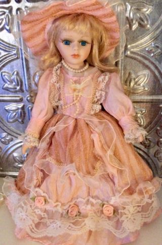 12 Inch Porcelain Doll Pink Dress And Hat Blonde Curly Hair