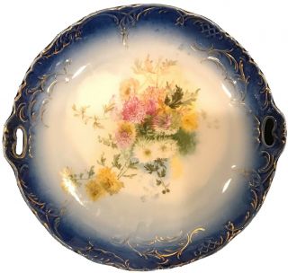 Vtg 9.  5”diameter Hand Painted Flowers Plate Germany Blue Trim Gold Guilding
