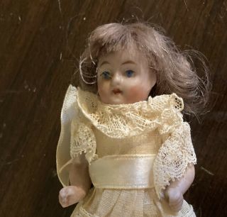 Antique German Miniuature Bisque Dollhouse Doll 3 1/2” Tall Brunette Hair