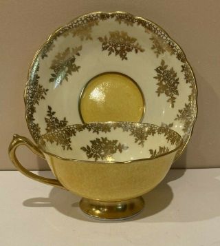 Paragon Gold Design On Beige With Bright Yellow Exterior Tea Cup And Saucer Set