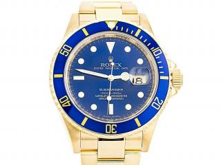 Rolex Submariner 40mm.  Ref:16618lb Yellow Gold 18k.  Box & Papers 2007