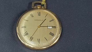 Vintage Caravelle Pocket Hand Wind Watch W/ Date And Price Tag