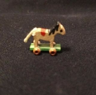 Miniature Dollhouse Wooden Hobby Horse W/ Wheels Hand Painted W/ Yarn Tail.  5 "