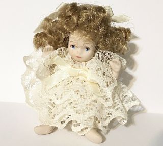 Miniature Sitting Solid Porcelain Doll With Ringlets Hair & Lace Ruffle Dress
