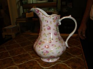 Pitcher By Royal Danube,  Pinkish Flowers With Gold Trim On Handle And Opening.