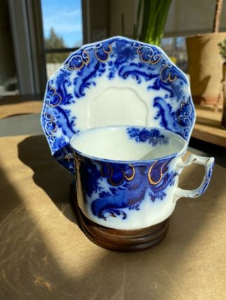 Flow Blue Argyle Cup And Saucer