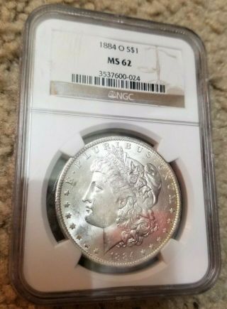 1884 - O Morgan Silver Dollar Ngc Ms62 - Minor Toning On Backside