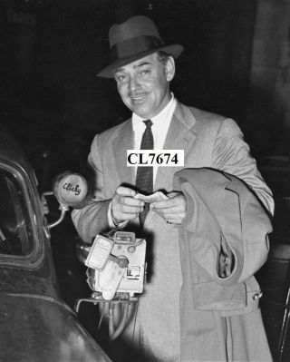 Clark Gable Paying His Cab Drive In Paris,  France Photo