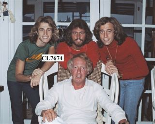 Bee Gees: Andy Gibb,  Barry Gibb,  And Robin Gibb With Robert Stigwood Photo