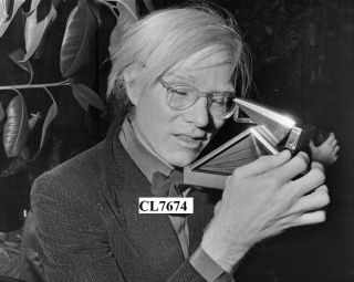 Andy Warhol Taking A Photo With His Polaroid Camera Photo