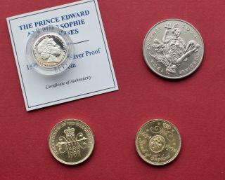 Four United Kingdom Coins - Entente Cordiale £5 - Silver £1 - Bill Of Rights £2.